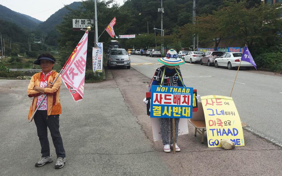 South Koreans protest U.S. and South Korean military plans to deploy an advanced U.S. missile defense system known as THAAD in the southeastern Seongju area, Wednesday, Sept. 28, 2016. They are standing near the road leading to the Lotte Skyhill Country Club, where the anti-missile battery will be stationed.