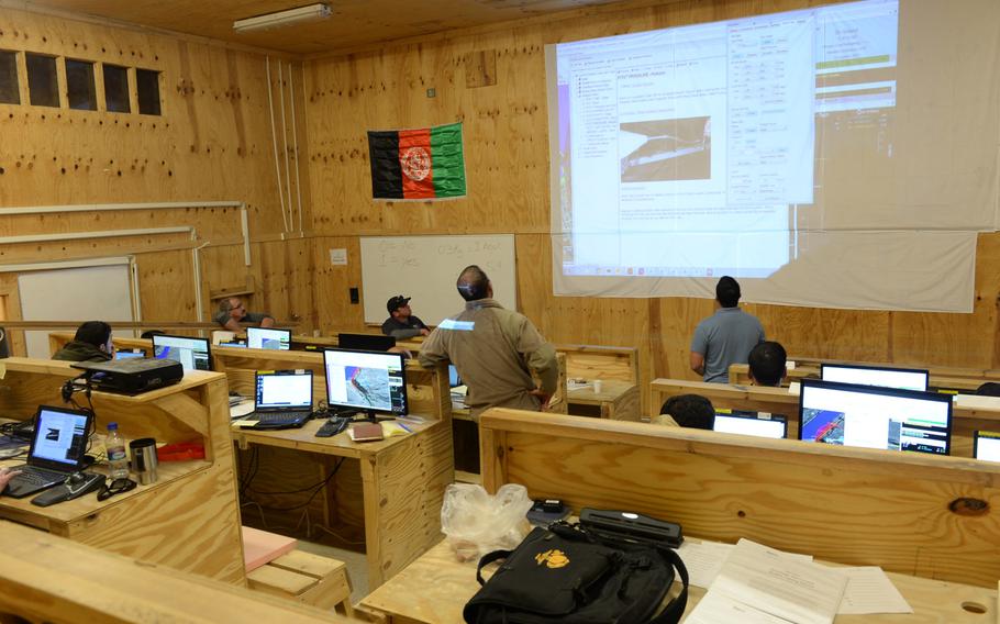 Instructors employed by Insitu, a Boeing subsidiary, teach trainee Afghan drone pilots how to operate ScanEagle unmanned aerial vehicles at a school outside the city of Mazar-e-Sharif on Wednesday, Oct. 26, 2016. The Afghans are currently setting up their first surveillance drone program.