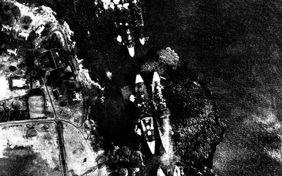 A photo taken of Battleship Row from a Japanese bomber flying at 10,000 feet during the Dec. 7, 1941, attack on Pearl Harbor. The USS Arizona, second pair from the top, has just been hit.