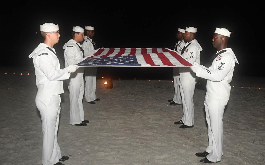 Sailors from Naval Station Mayport's color guard prepare to fold the flag during a Life Counts Candlelight Ceremony in Jacksonville, Fla., Sep. 13, 2016, in honor of service members who have committed suicide.

Mark Andrew Hays/U.S. Navy
