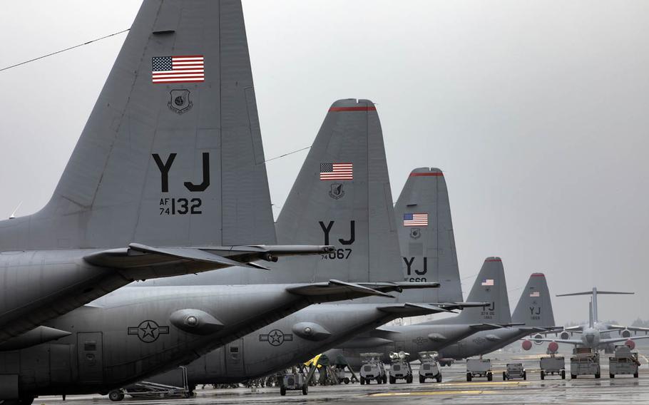 Five C-130 Hercules aircraft park on the flightline in September at Yokota Air Base, Japan. 