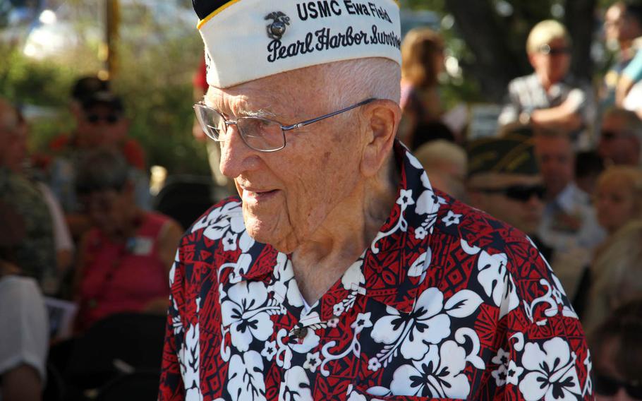 John Hughes speaks with guests after a ceremony Tuesday, Dec. 6, 2016, at Ewa Field commemorating the actions of Marines during the surprise attack by Japan 75 years ago at the site. Hughes, then a sergeant, alerted his fellow Marines that the commotion they heard was no drill.