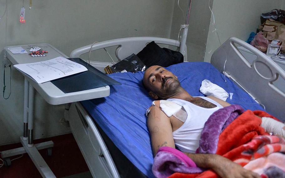 Fars Sbuh Saud, an Iraqi soldier, is treated at the West Irbil Emergency Hospital on Sunday, Nov. 20, 2016. Former Army nurses living in New England say they are pessimistic about the difficulties that lie ahead in Mosul, Iraq.