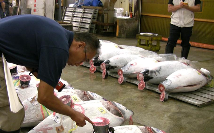 Tokyo's bustling Tsukiji fish market has been selling seafood since before World War II. More than 2,000 tons of fish is sold each day.