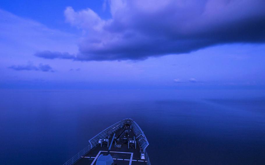 The guided-missile cruiser USS Chancellorsville transits the South China Sea in July. Reports say China flew a nuclear-capable bomber along the so-called "Nine-Dash Line" over the disputed sea last week in response to President-elect Donald Trump's historic phone call with Taiwan's president.