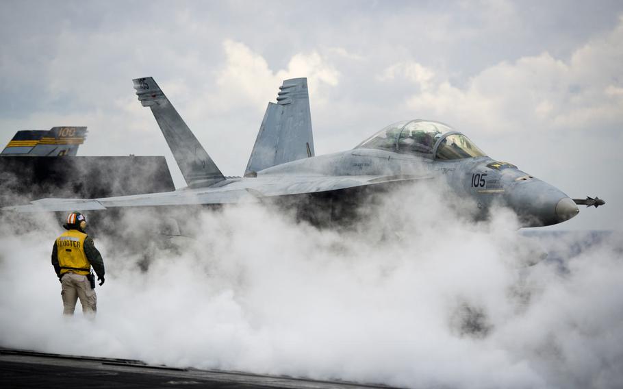An F/A-18F Super Hornet is prepared for launch aboard the USS Dwight D. Eisenhower, Thursday, Dec. 8, 2016.