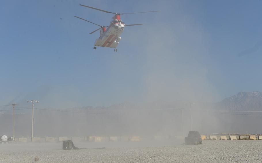 A helicopter lands at sling load yard at Bagram Air Field, Afghanistan, Dec. 5, 2016. The operations are increasingly important as part of supplying smaller bases that lack airfields.