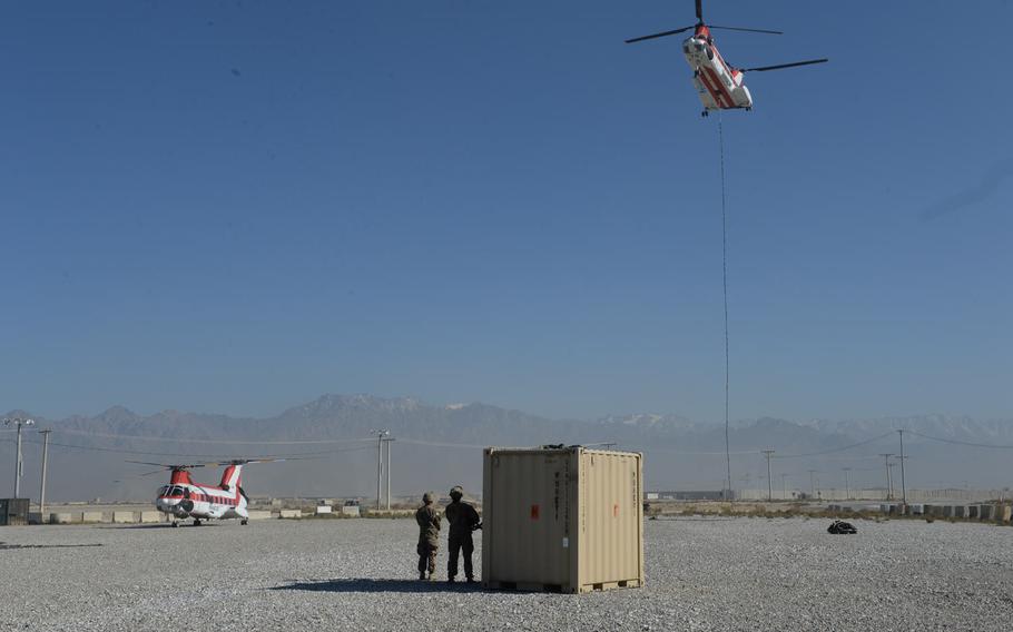 After being connected to a piece of cargo with a 250-foot cable, a helicopter begins its ascent at Bagram Air Field on Dec. 5, 2016. The helicopter will move the cargo to another base in Afghanistan.