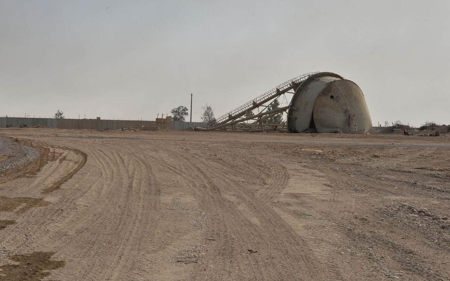 A toppled water tower at Qayara Airfield West, pictured here on Nov. 21, 2016, is a familiar sight to veterans of Operation Iraqi Freedom, who returned to the base to help stand it up as a logistics hub in the battle to retake Mosul from Islamic State militants.