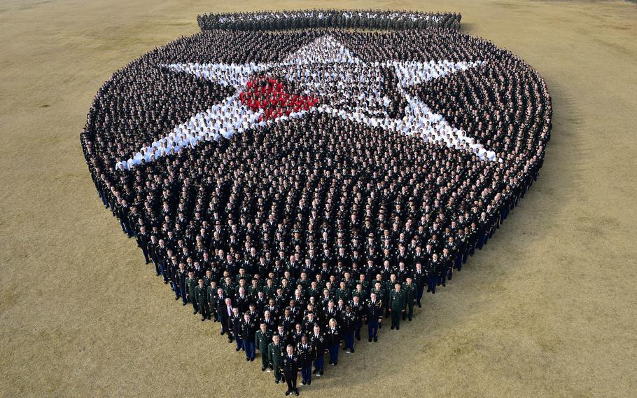 More than 5,000 soldiers led by Maj. Gen. Ted D. Martin, commanding general for the 2nd Infantry Division, re-create the division's insignia at Camp Casey, South Korea, Wednesday, Dec. 21, 2016.