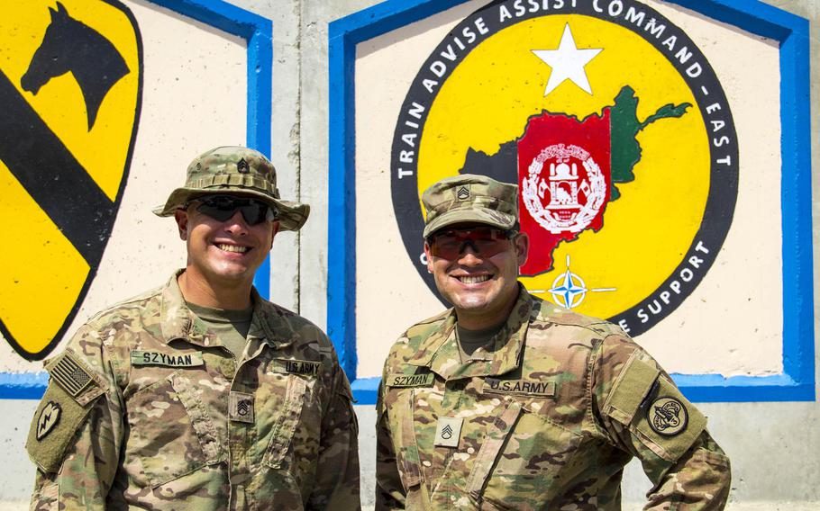 Staff Sgt. Mark Szyman, left, and his younger brother, Staff Sgt. Nicholas Szyman, pose for a photo at Tactical Base Gamberi in eastern Afghanistan on Saturday, Dec. 17, 2016. Despite being together, the brothers say it is still difficult to be away from home during the holidays.