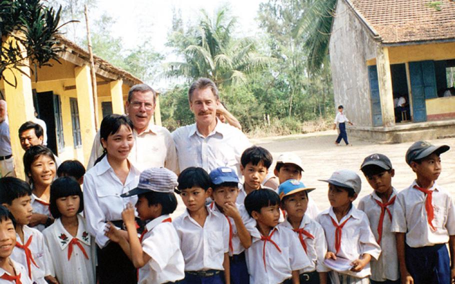 Lawrence Colburn, right, and his helicopter pilot Hugh Thompson at My Lai village, March, 16, 1998.
