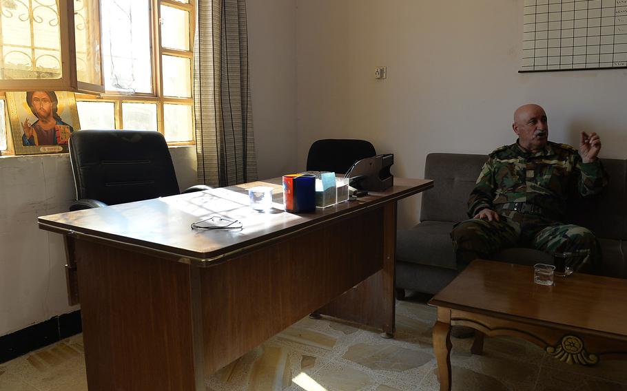 Mubarak Toaya, assistant commander of the Christian militia group Nineveh Plain Protection Units, in his office at a makeshift base for the anti-Islamic State fighters in the Christian town of Qaraqosh, Iraq, on Nov. 14, 2016.