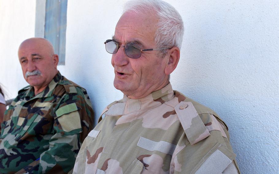 Benham Aboush Almaseh, founder of the Assyrian Christian militia known as the Nineveh Plain Protection Units, is pictured here with his assistant commander, Mubarak Toaya, at a training camp for the group near the Christian village of Alqosh on Saturday, July 23, 2016.