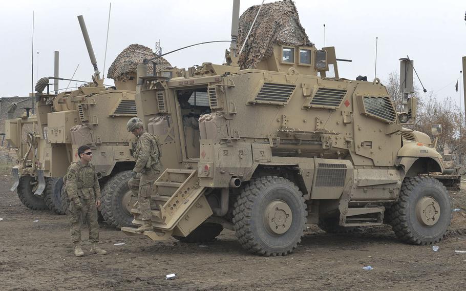 Soldiers of Apache Company, 1st Battalion, 26th Infantry Regiment dismount a Mine Resistant Ambush Protected vehicle after a reconnaissance mission on Wednesday, Dec. 28, 2016. The men of Apache Company are advising local police and providing security on a tactical base near the front lines in the campaign to push Islamic State from Mosul, Iraq.
