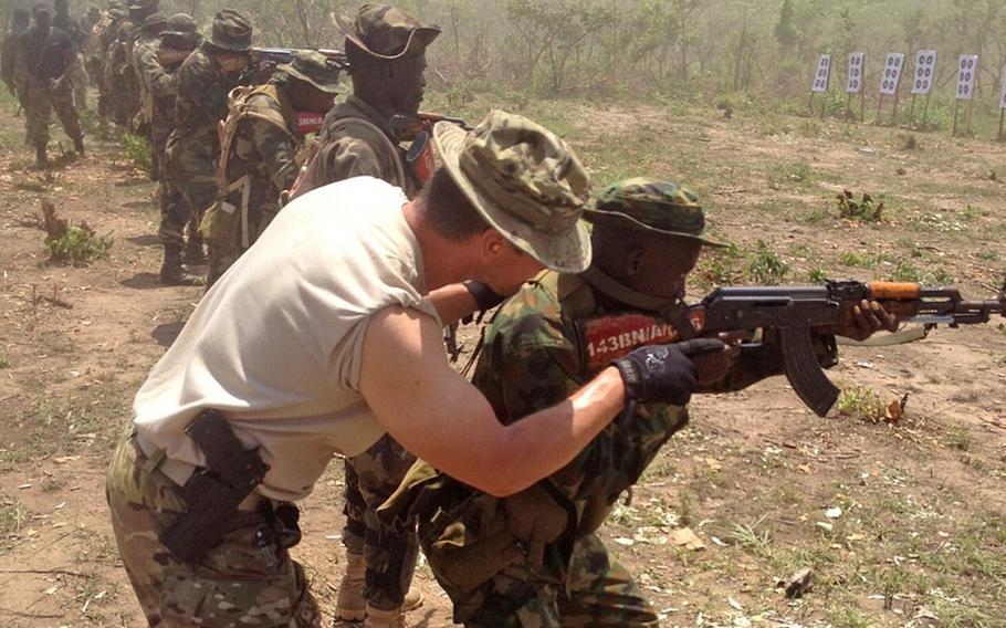 A California National Guard Special Forces soldier trains with a Nigerian soldier in Nigeria in June 2014. The Nigerian soldiers are being trained to counter Boko Haram.