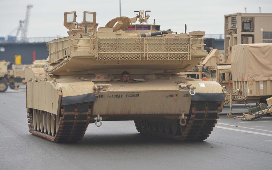 An M1A1 Abrams tank rolls through the port of Bremerhaven, Germany, after being unloaded from a ship, Sunday, Jan. 8, 2017. The 3rd Armored Brigade Combat Team, 4th Infantry Division, out of Fort Carson, Col., is headed for Poland for a nine-month rotation as part of Operation Atlantic Resolve.