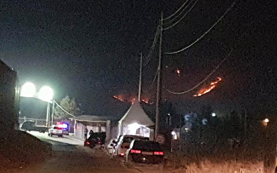 A U.S. Kiowa helicopter sparked a fire during a training exercise on the mountainside at the Rodriguez Live Fire Range, South Korea, Tuesday, Jan. 17, 2017. No one was injured, but the blaze left an area the size of half a football field charred.