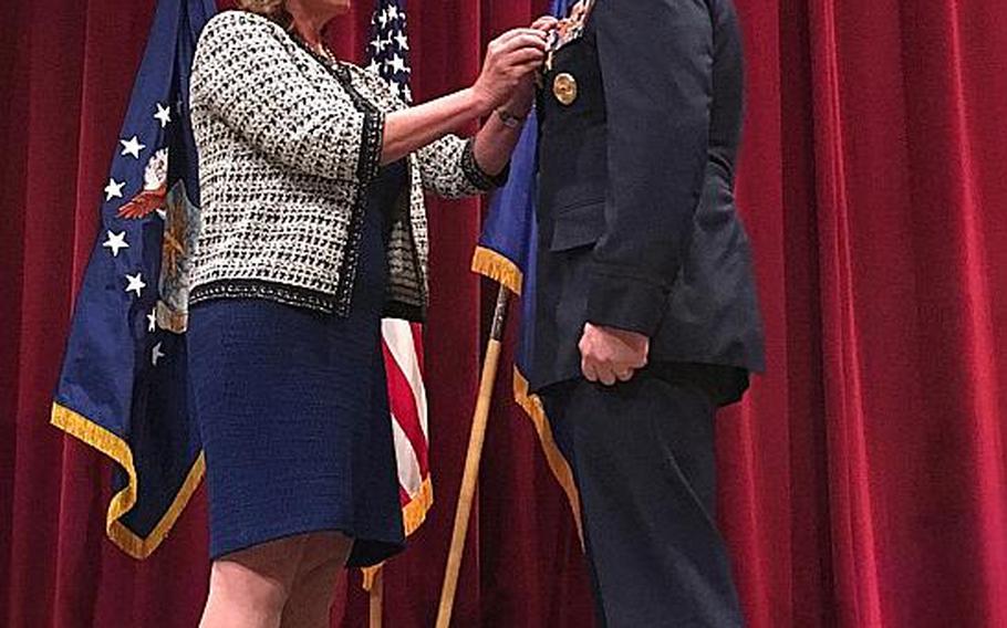 Secretary of the Air Force Deborah Lee James awards Col. Chris Barnett two Silver Stars for gallantry in action for two rescue missions in 2009.