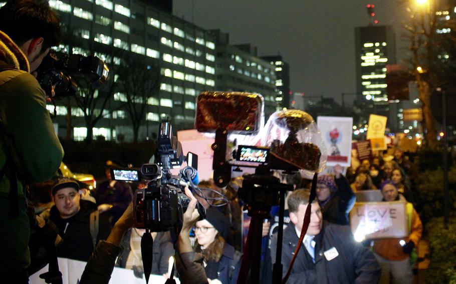 Japanese media surround the participants in the Women's March in central Tokyo on Jan. 20, 2017.