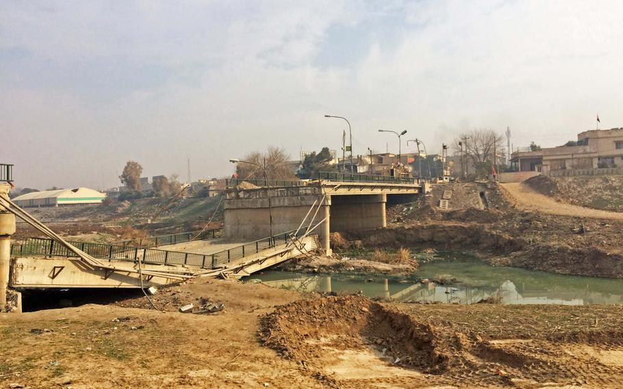A damaged bridge over the Khoser River in Mosul, Iraq, Saturday, Jan. 21, 2017. The area was liberated in a surprise night operation by Iraqi Special Forces last week. 