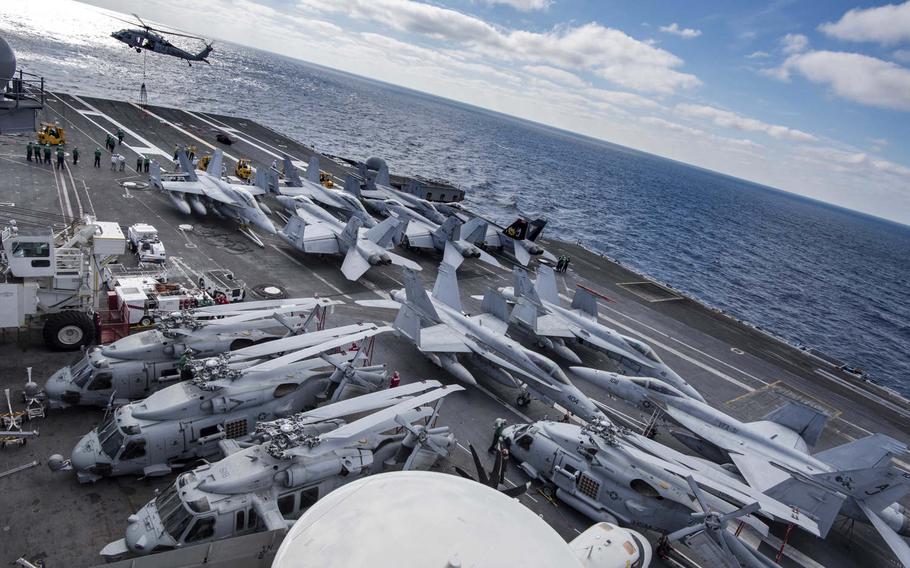 Aircraft are staged on the flight deck of the aircraft carrier USS George H.W. Bush, Dec. 8, 2016. The George H.W. Bush Carrier Strike Group deployed on Saturday, Jan. 21, 2017, to the 5th Fleet and 6th Fleet area of operations to support the campaign against the Islamic State group. 