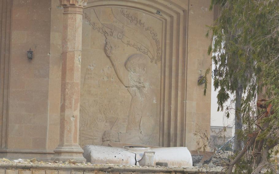 Saddam Hussein's face was erased by Islamic State militants at a palace overlooking the Tigris River in Mosul, Iraq.