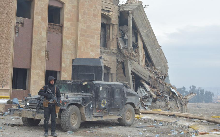 An Iraqi soldier stands guard at a palace in Mosul, Iraq, on Wednesday, Jan. 25, 2017