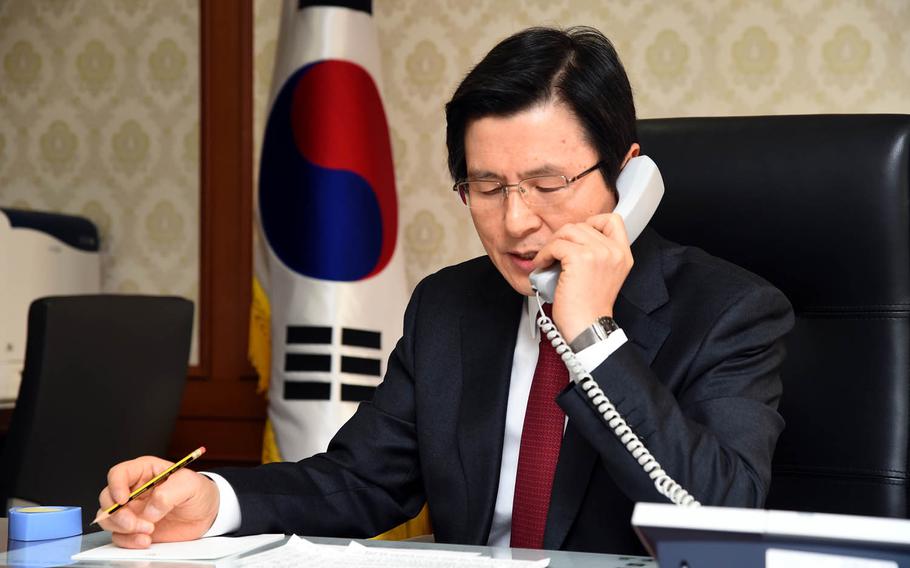 South Korea's acting President Hwang Kyo-ahn speaks to President Donald Trump, Monday, Jan. 30, 2017.