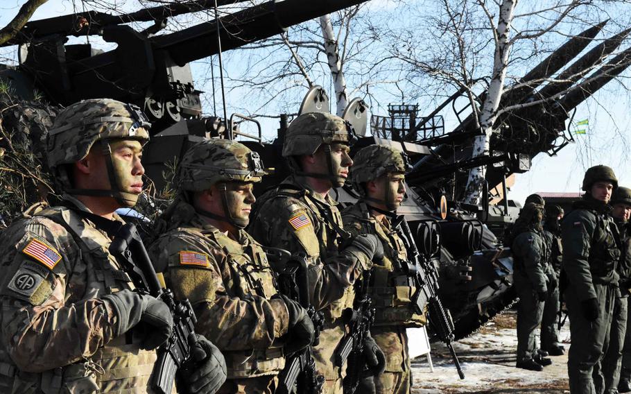 American and Polish soldiers in front of their vehicles at the live fire exercise in Zagan, Poland, on Monday, Jan. 30, 2017.