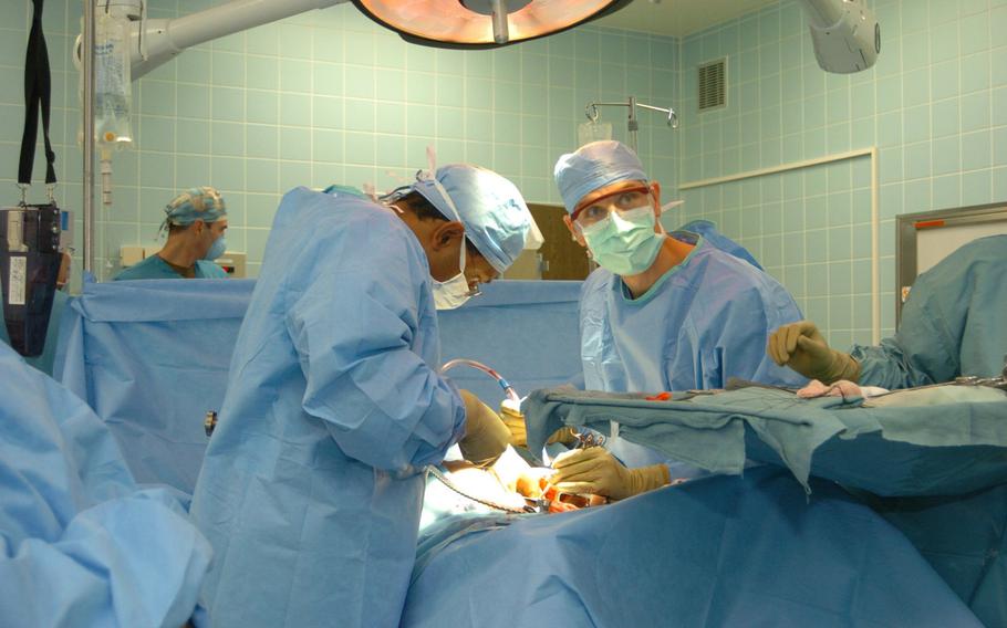 Doctors perform a surgery at Landstuhl Regional Medical Center. Surgery is one of the specialty clinics at LRMC that has received patients referred from the hospital's new Enhanced Access Clinic, which is designed to improve access for military members, their families and civilians.