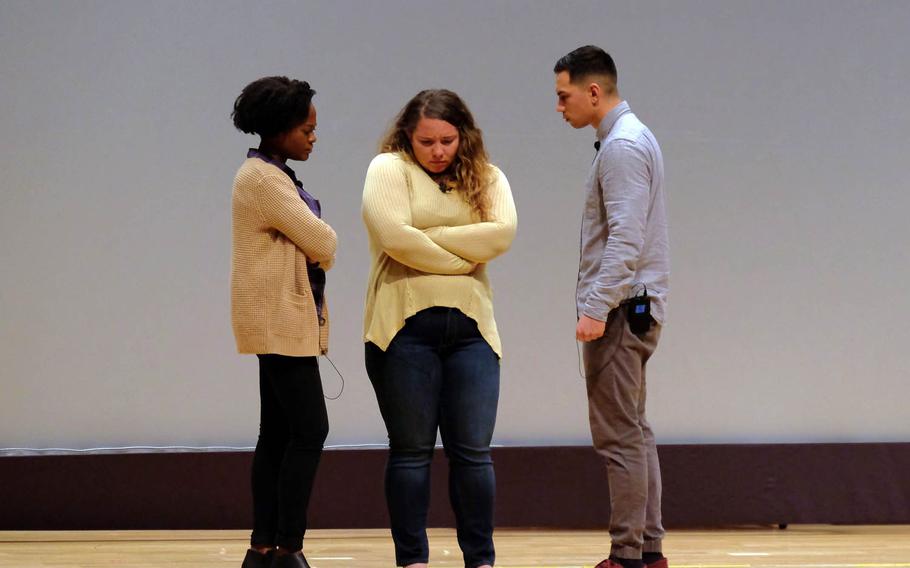 Members of the Pure Praxis actors' group role-play a scenario involving a sailor being ostracized by her friends after reporting being raped, Wednesday, Feb. 15, 2017, at Yokosuka Naval Base, Japan.