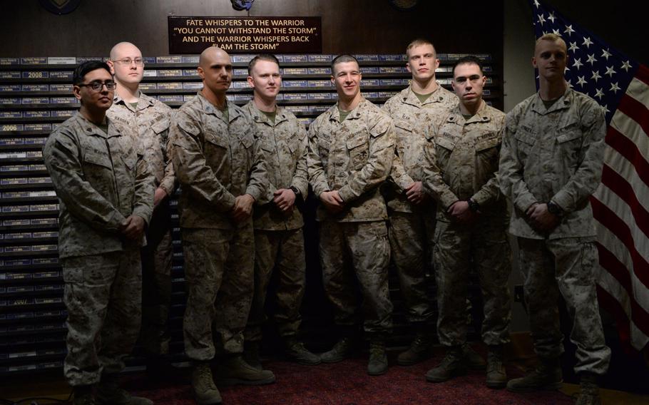 Members of the Marine Security Guard detachment in Kabul, Afghanistan, stand in front of a memorial to other Marines and Navy corpsmen who have died in Afghanistan since 2001, Thursday, March 2, 2017. From left,
Sgt. Nelson Moreno, Sgt. Bryan Barden, Gunnery Sgt. Christopher Tari, Sgt. Layton Nobles, Sgt. Zachary Phillips, Sgt. Joel Ream, Sgt. Owen Nardini and Sgt. Christopher Vincent.