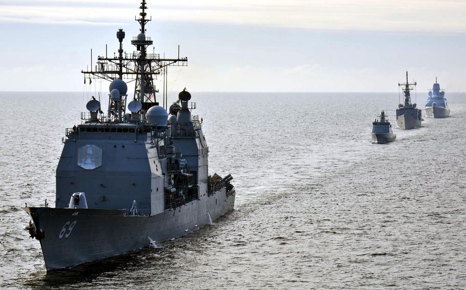 From left, Standing NATO Maritime Group 2 ships USS Vicksburg , Lithuanian frigate LNS Aukstaitis, Turkish ship TCG Goksu and Dutch ship HNLMS Tromp participate in ship maneuvering drills during a passing exercise in the Baltic Sea in 2015.
