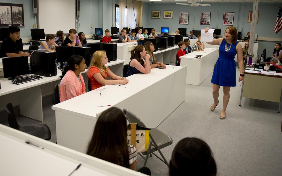 Sixth-grade students receive their schedules during the first day of school at Kaiserslautern Middle School at Vogelweh, Germany, on Aug. 29, 2016. DODEA says it can begin filling vacant teaching and other staff positions, after its request for an exemption to the federal hiring freeze was approved.