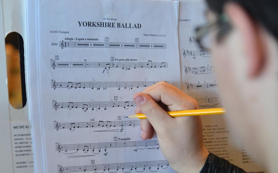 Vilseck's Carl Dalebout makes some notations on his sheet music during band rehearsals at the DODEA-Europe Honors Music Festival, Tuesday, March 14, 2017.