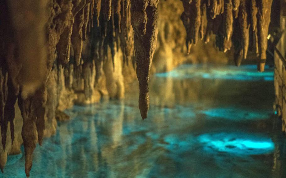 Strategically placed lighting gives water inside Okinawa's Gyokusendo Cave a rich blue color.