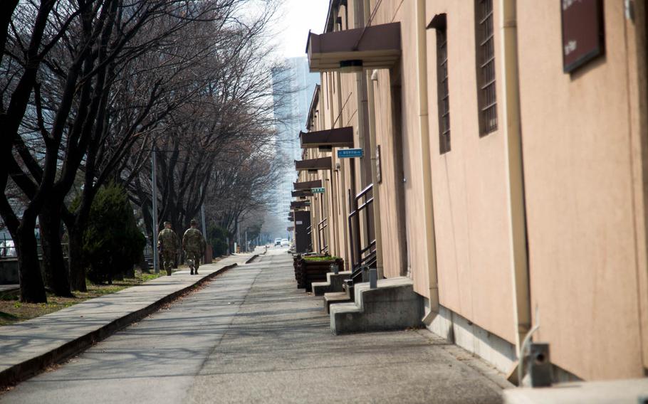 Soldiers walk down a side street at Yongsan Garrison in Seoul, South Korea, Thursday, March, 30, 2017.