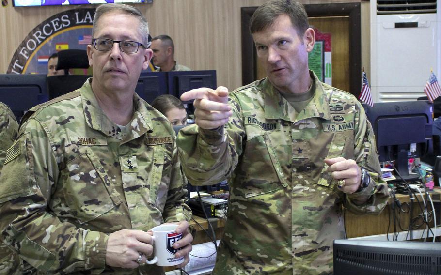 Brig. Gen. John Richardson, right, Combined Joint Forces Land Component Command deputy commanding general, explains the strike cell process to Maj. Gen. Daryl Bohac, the adjutant general for the Nebraska National Guard, March 27, 2017. Bohac visited the Combined Joint Operations Center-Irbil to see how Nebraska National Guard soldiers are contributing to the fight against the Islamic State group.