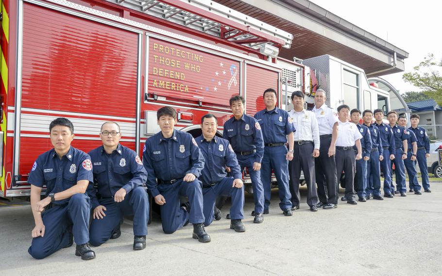 Chinhae Naval Base firefighters pose before a morning drill, Wednesday, April 12, 2017.