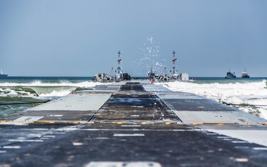 Waves crash onto trident pier at Dogu beach near Pohang, South Korea, Tuesday, April 18, 2017.