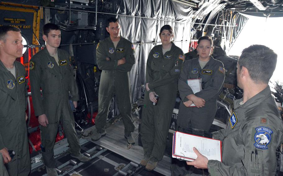 The crew of a C-130H cargo aircraft prepares for an airdrop mission out of Yokota Air Base, Japan, Thursday, April 20, 2017.