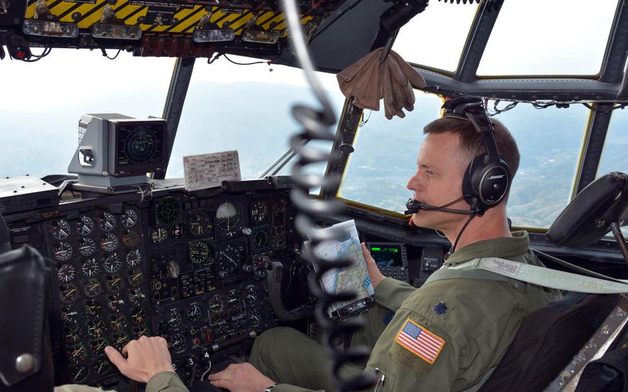 Pilot Lt. Col. John Kerr flies over Japan in a C-130H cargo plane, Thursday, April 20, 2017.