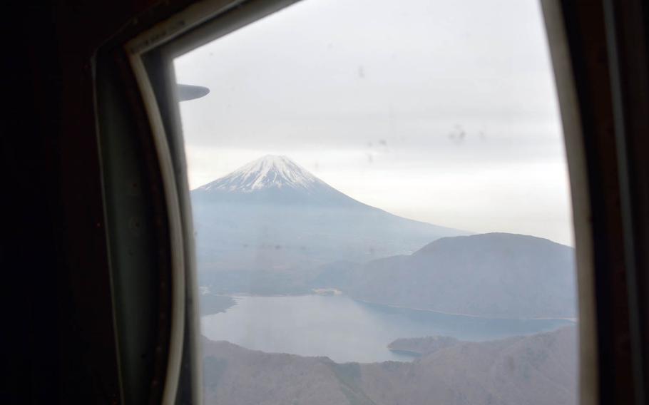 Mount Fuji is seen from the rear window of a C-130H Hercules, Thursday, April 20, 2017.