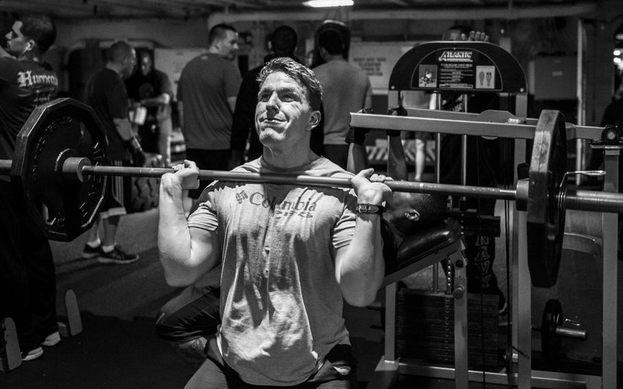 Petty Officer 3rd Class Skyle Closearzon, an aircrew survival equipmentman aboard the aircraft carrier USS George H.W. Bush, lifts weights during a deployment in the Persian Gulf, April 19, 2017.