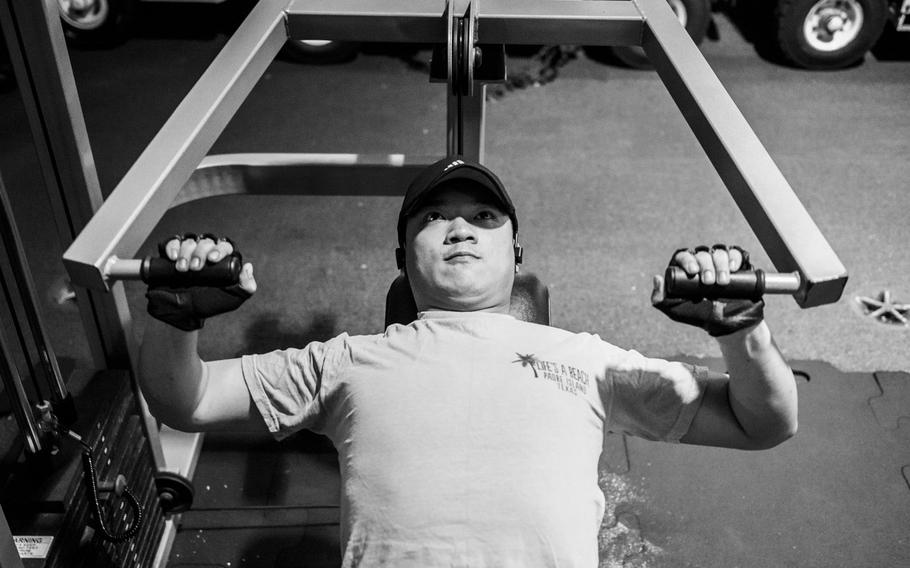 Airman recruit Nick Vo performs the incline chest press while working out during a deployment in the Persian Gulf, April 19, 2017.