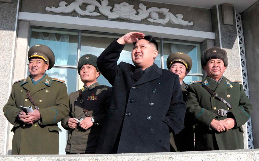North Korean leader Kim Jong Un, center, is pictured in this undated image from the Korean Central News Agency.