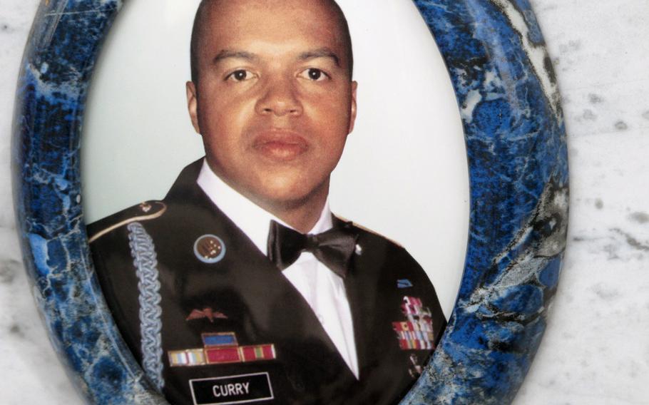 First Sgt. Michael Curry was killed in Afghanistan and was buried in Italy, where he'd made his home and life. His photograph appears on his cemetery site in Grantorto, Italy. The dining facility on Caserma Ederle is soon to be renamed the Curry Dining Facility 
                