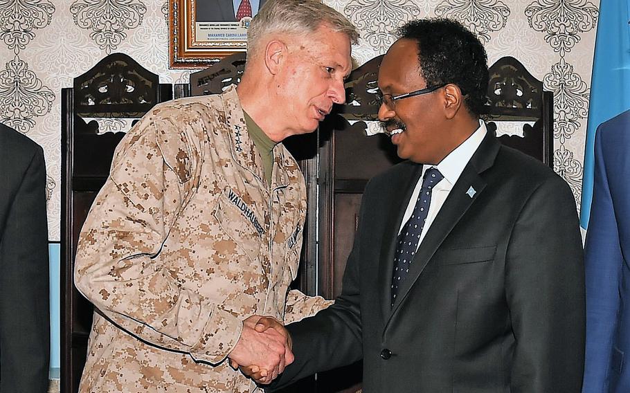 Commander of U.S. Africa Command, U.S. Marine Corps Gen. Thomas D. Waldhauser and President of Somalia Mohamed Abdullahi Mohamed, shake hands after their meeting held at Mogadishu International Airport, Somalia, Saturday, April 29, 2017.