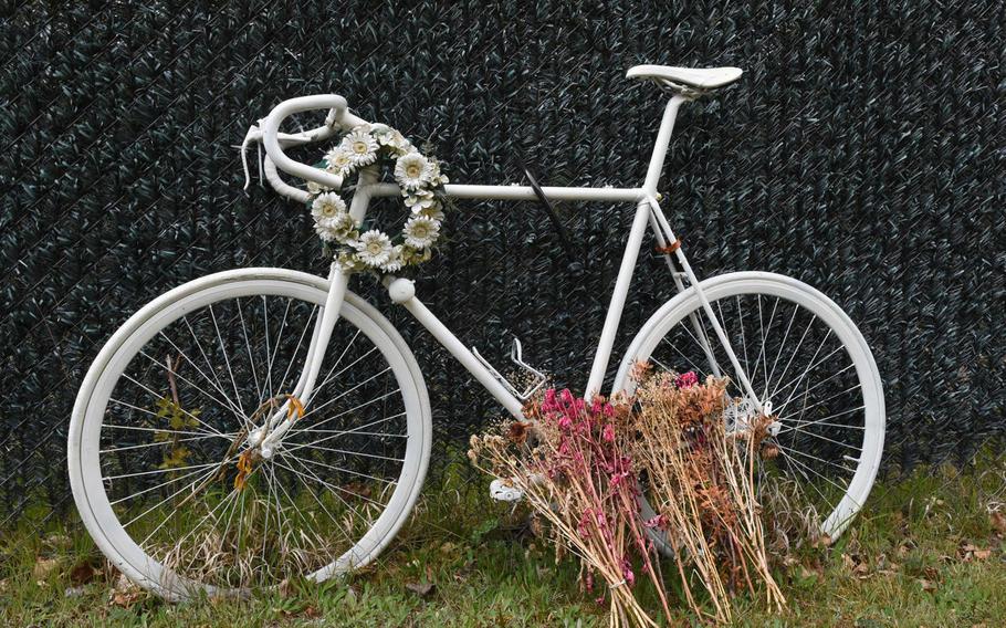 A bicycle memorial sits by the roadside outside Ramstein Air Base, Germany, near where Air Force Staff Sgt. Grant Davis died on March 26, 2016, when his bicycle was struck by a car. Senior Airman Benjamin Hann was convicted Wednesday, May 3, 2017, of negligent homicide in connection with Davis's death.